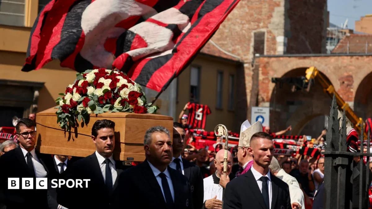 Coffin carried during memorial procession with fans Coffin carried during memorial procession with fans