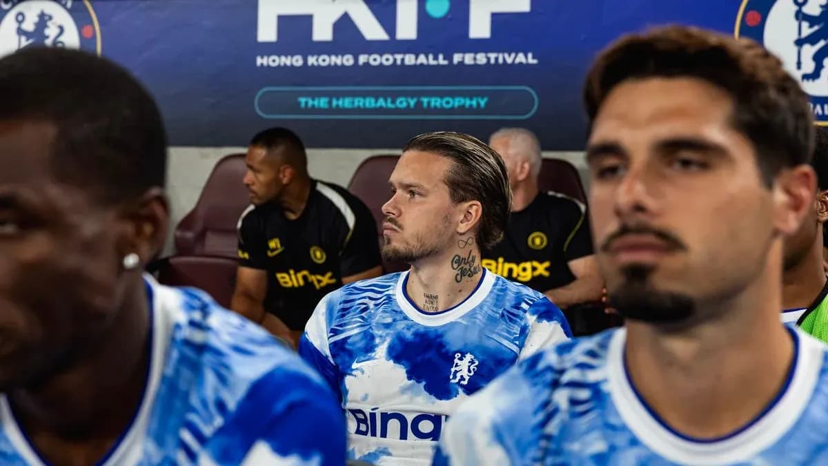 Chelsea players seated on bench before match Chelsea players seated on bench before match