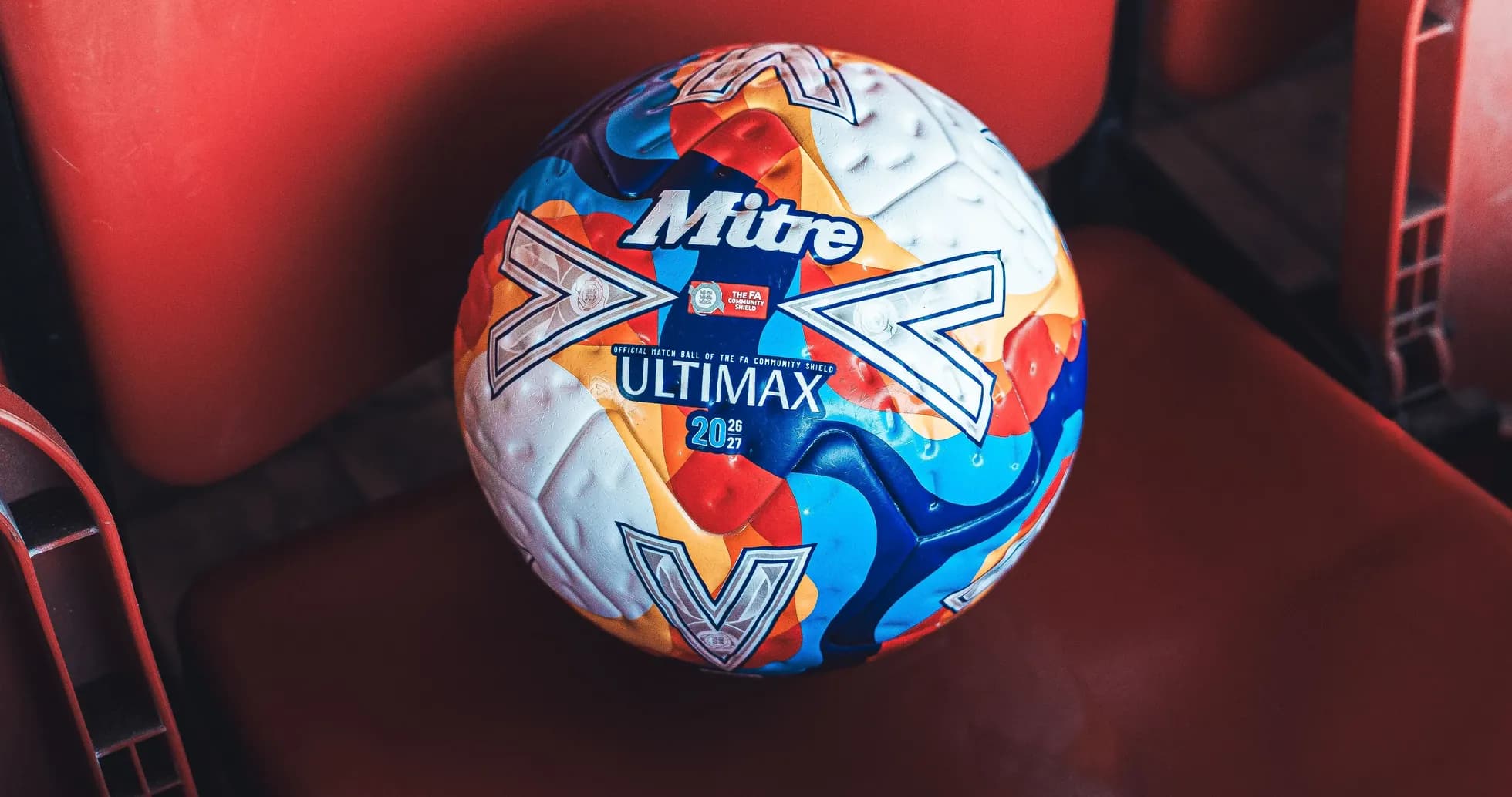 Mitre Ultimax football on stadium seat Mitre Ultimax football on stadium seat