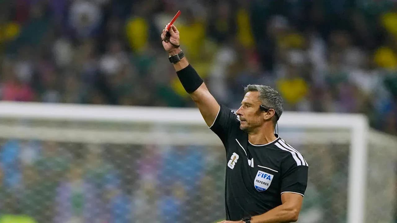 Referee showing a red card during a match Referee showing a red card during a match