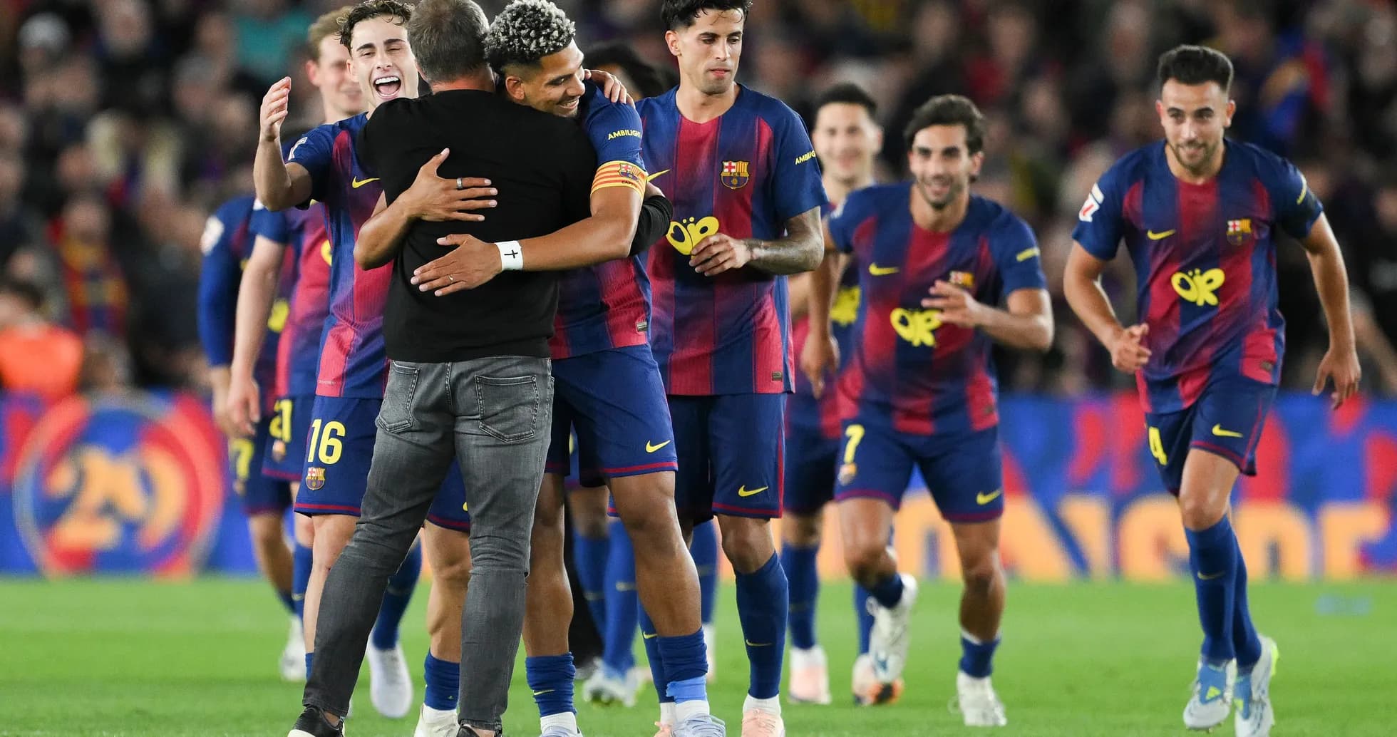Barcelona players celebrating with coach after match Barcelona players celebrating with coach after match
