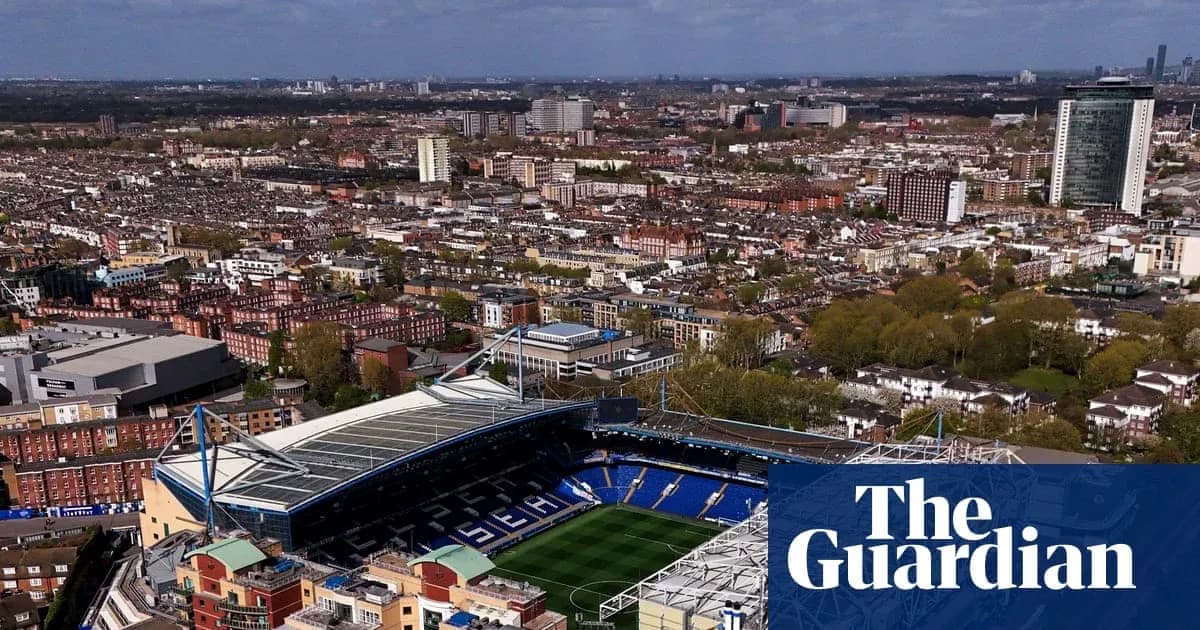 Aerial view of a football stadium and city Aerial view of a football stadium and city