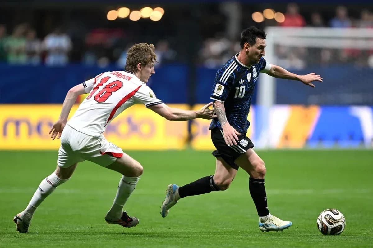 Player running with ball while being challenged Player running with ball while being challenged
