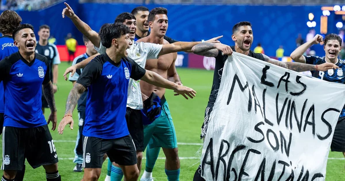 Argentina players celebrating with a banner on field Argentina players celebrating with a banner on field