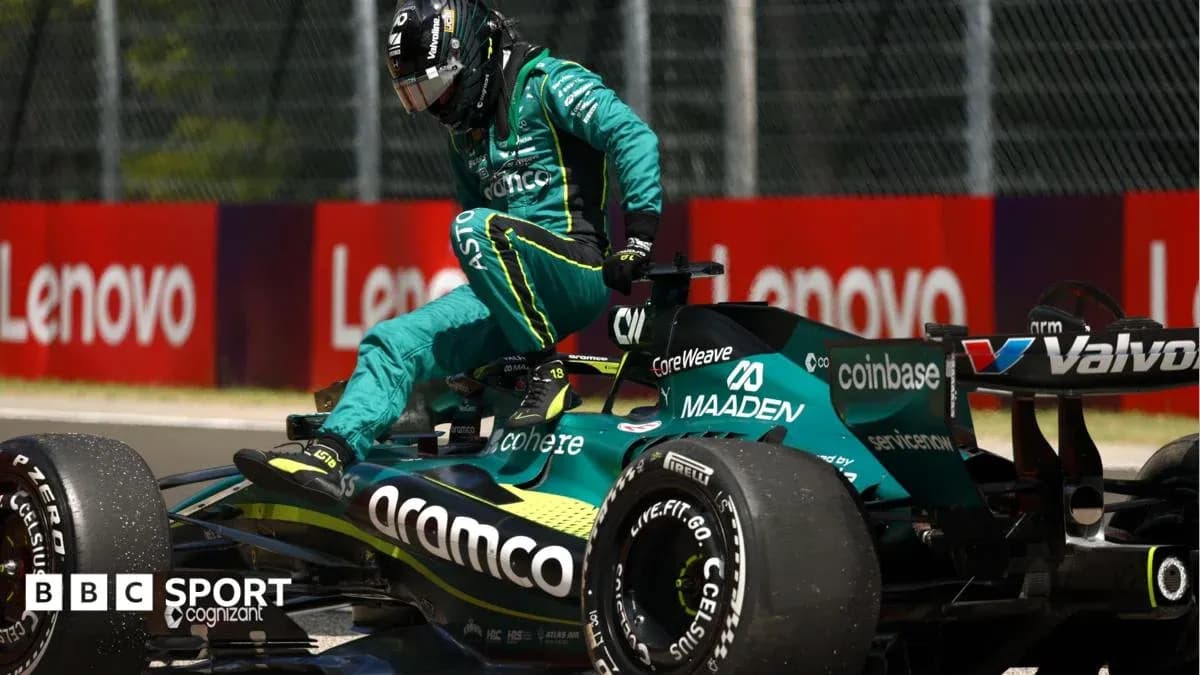 Driver exiting Aston Martin F1 car during race Driver exiting Aston Martin F1 car during race
