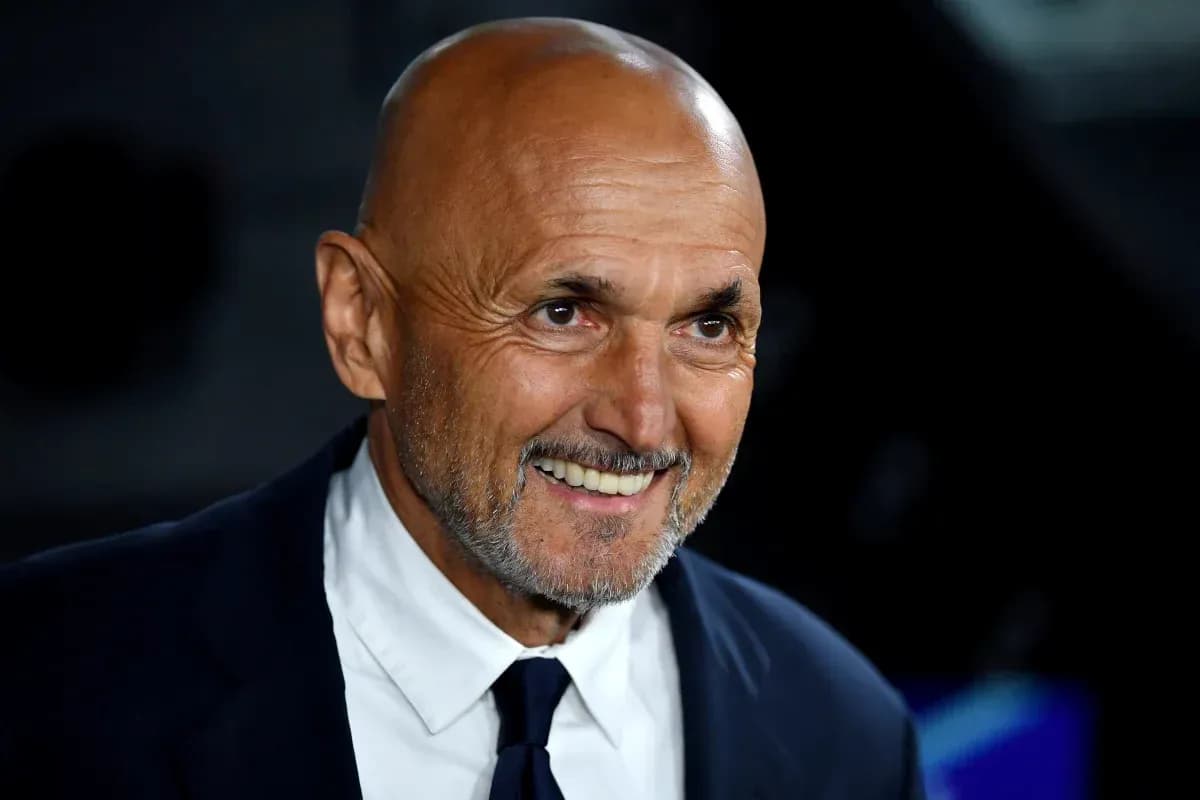 Bald man in suit smiling at event Bald man in suit smiling at event