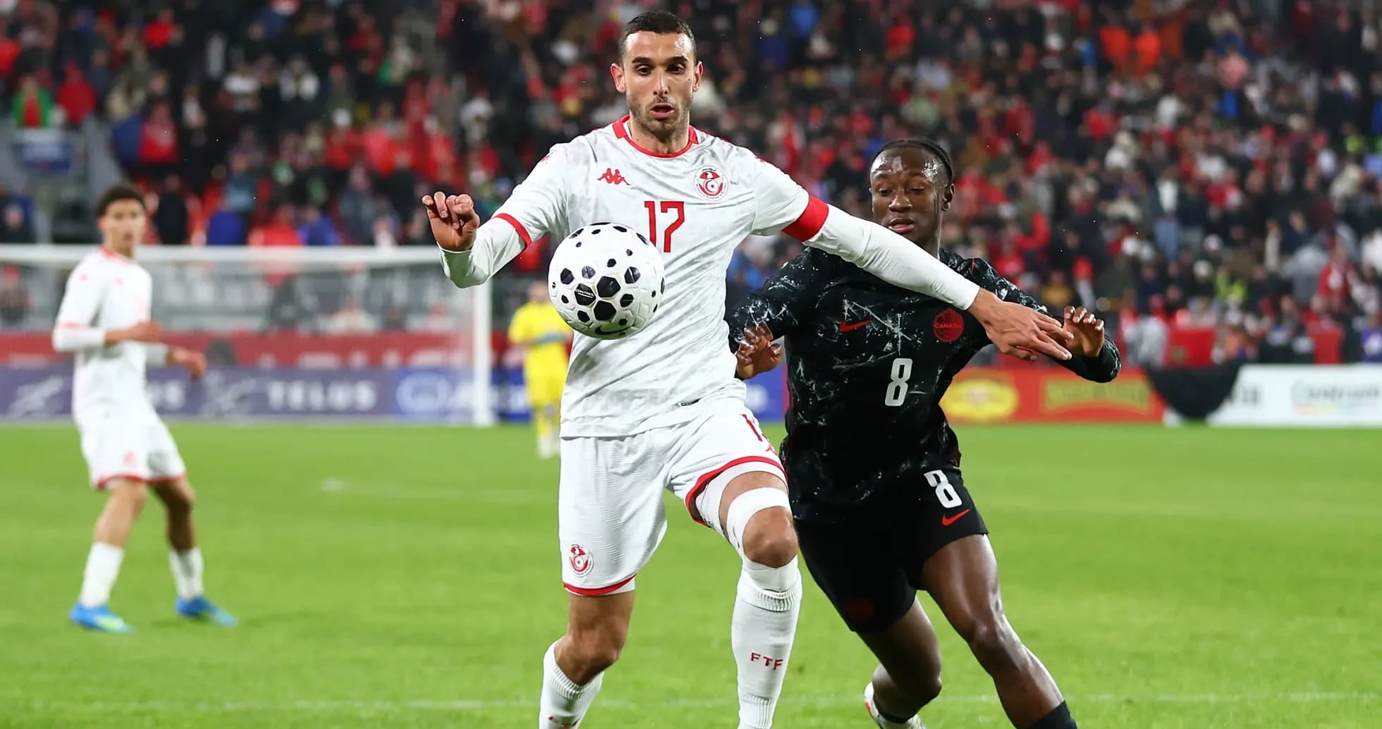 Tunisian player controlling the ball during match Tunisian player controlling the ball during match