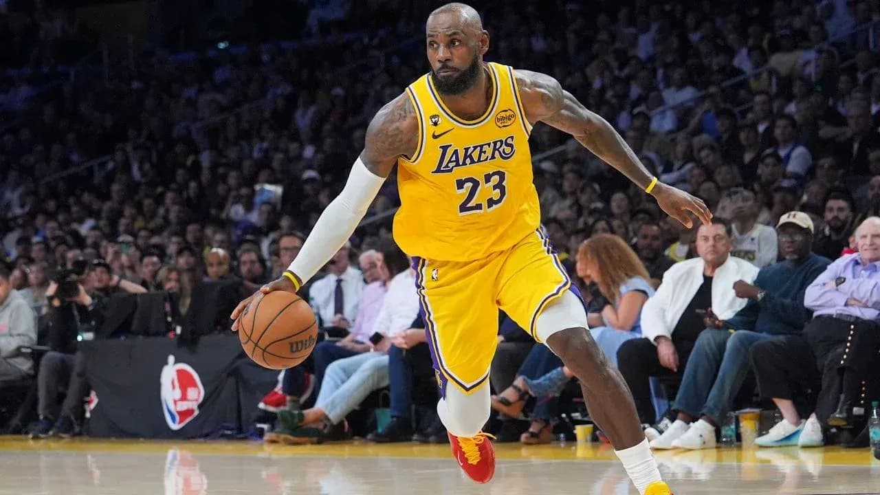 LeBron James dribbling basketball during game LeBron James dribbling basketball during game