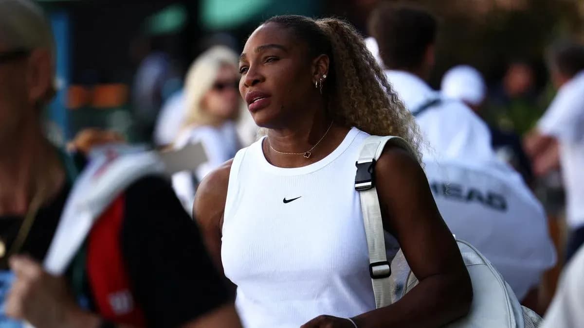 Tennis player walking with bag in crowd Tennis player walking with bag in crowd