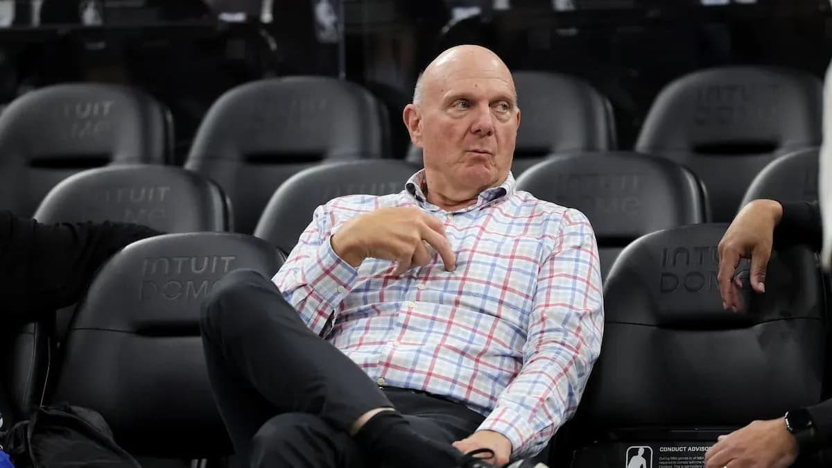 Man sitting in arena seats during game Man sitting in arena seats during game