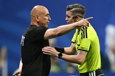 Referee discussing with coach during match Referee discussing with coach during match