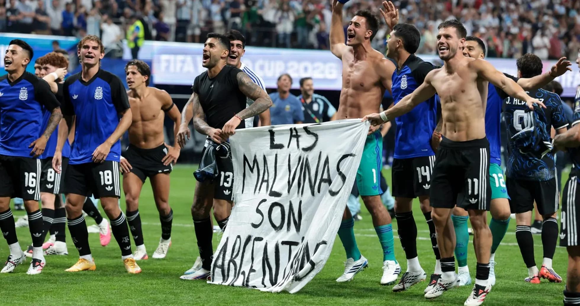 Argentinian players celebrating with a banner Argentinian players celebrating with a banner