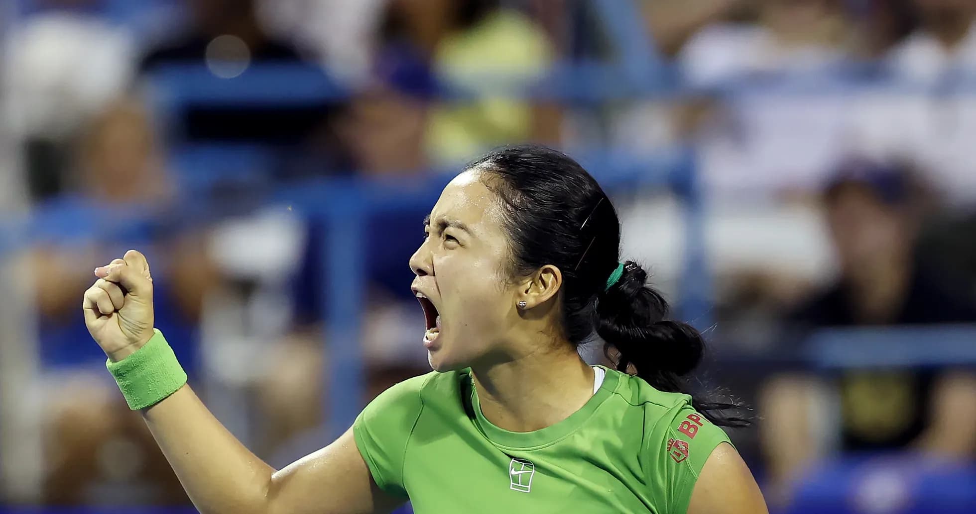 Tennis player celebrating with fist pump during match Tennis player celebrating with fist pump during match