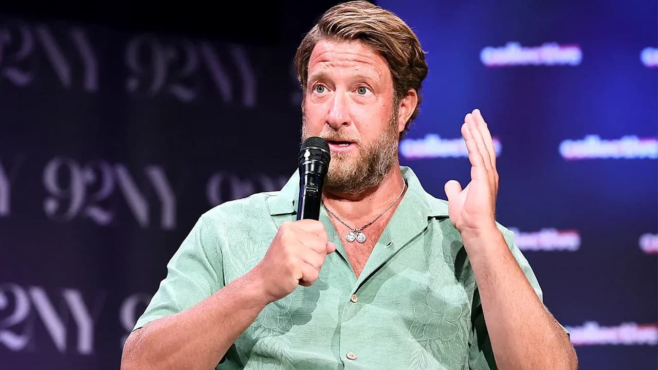 Man speaking into microphone at event Man speaking into microphone at event