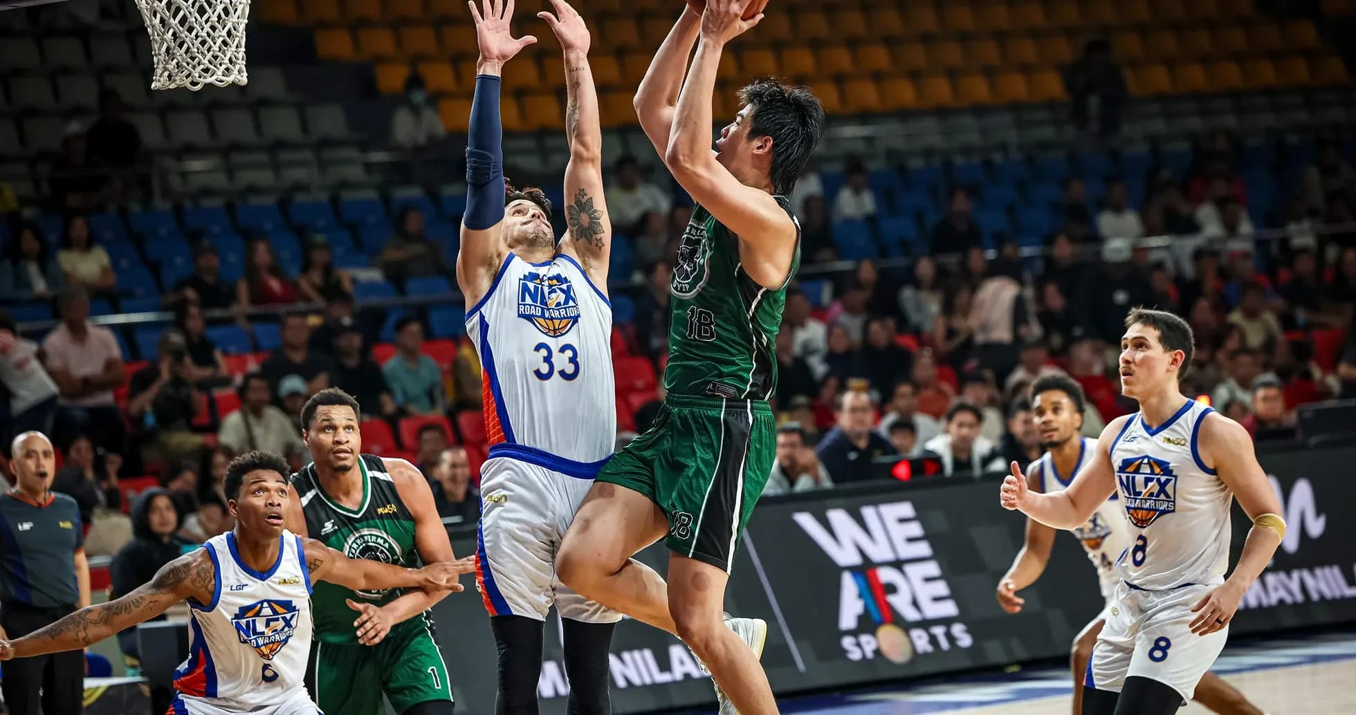 Player shooting during basketball game action Player shooting during basketball game action