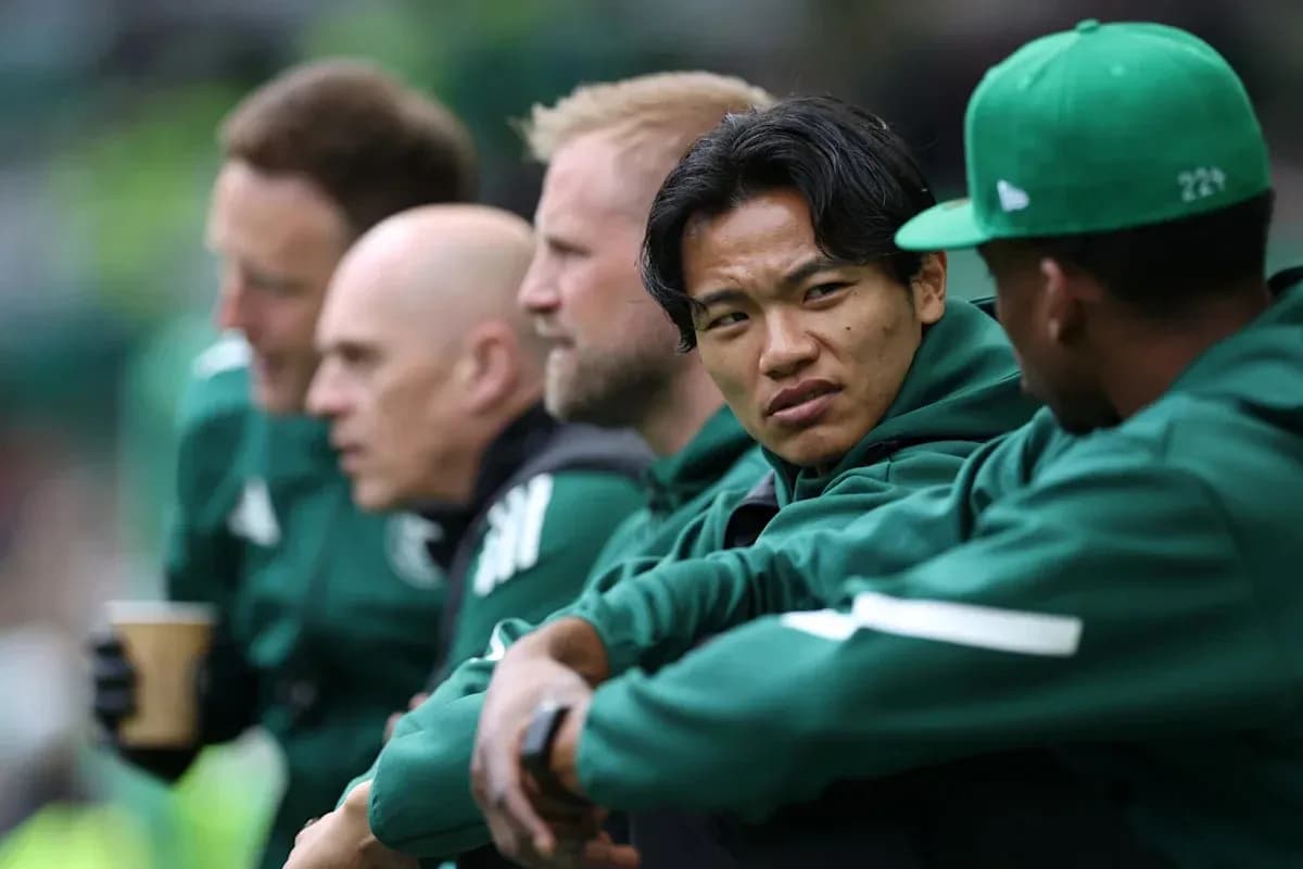 Players seated on bench during match discussion Players seated on bench during match discussion