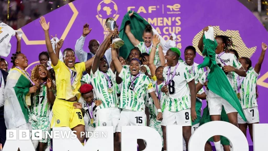 Nigeria women's team celebrating AFCON victory with trophy Nigeria women's team celebrating AFCON victory with trophy