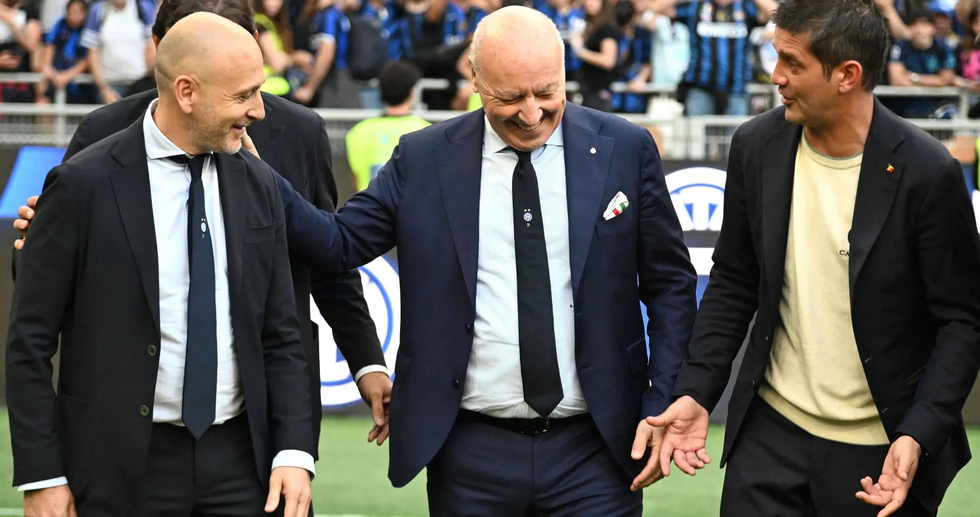 Coaches interacting on the pitch before the match Coaches interacting on the pitch before the match