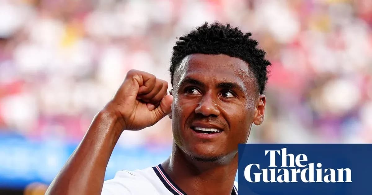 Futbolchi qo'lini ko'tarib g'alaba nishoni bermoqda Futbolchi qo'lini ko'tarib g'alaba nishoni bermoqda