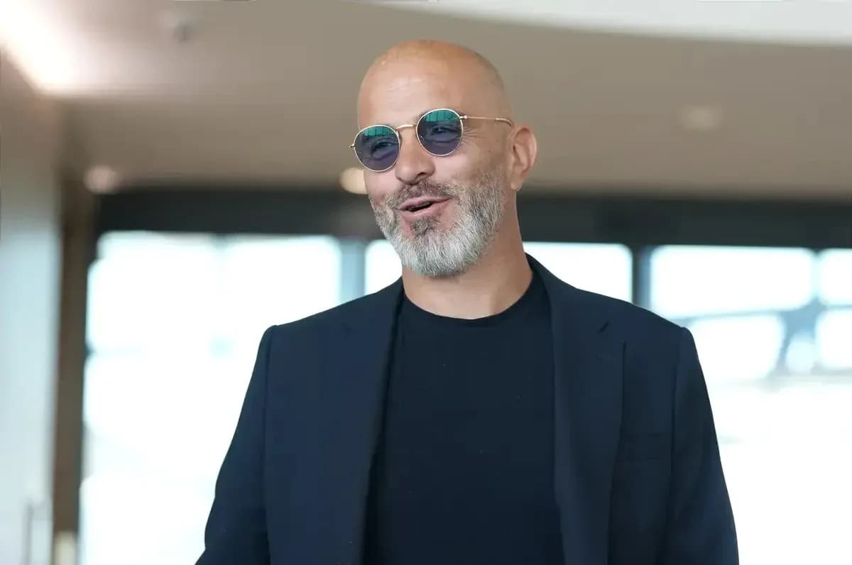 Man in sunglasses smiling indoors Man in sunglasses smiling indoors