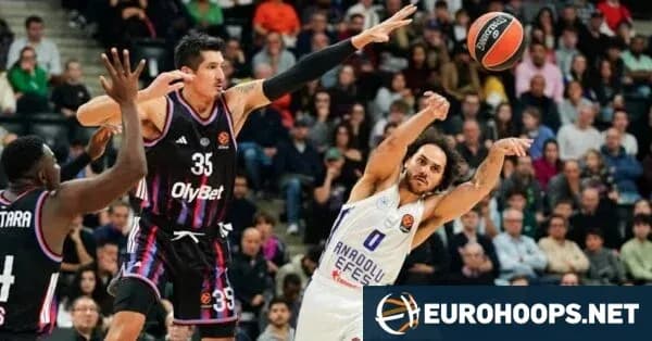 Anadolu Efes player shooting during basketball game Anadolu Efes player shooting during basketball game