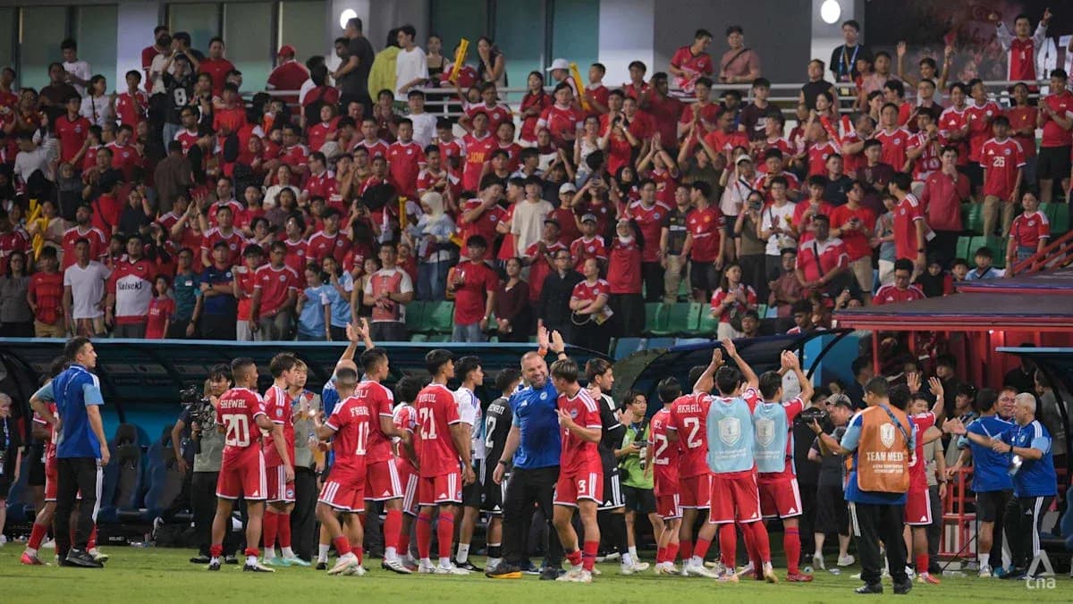 Football team celebrating with fans in stadium Football team celebrating with fans in stadium