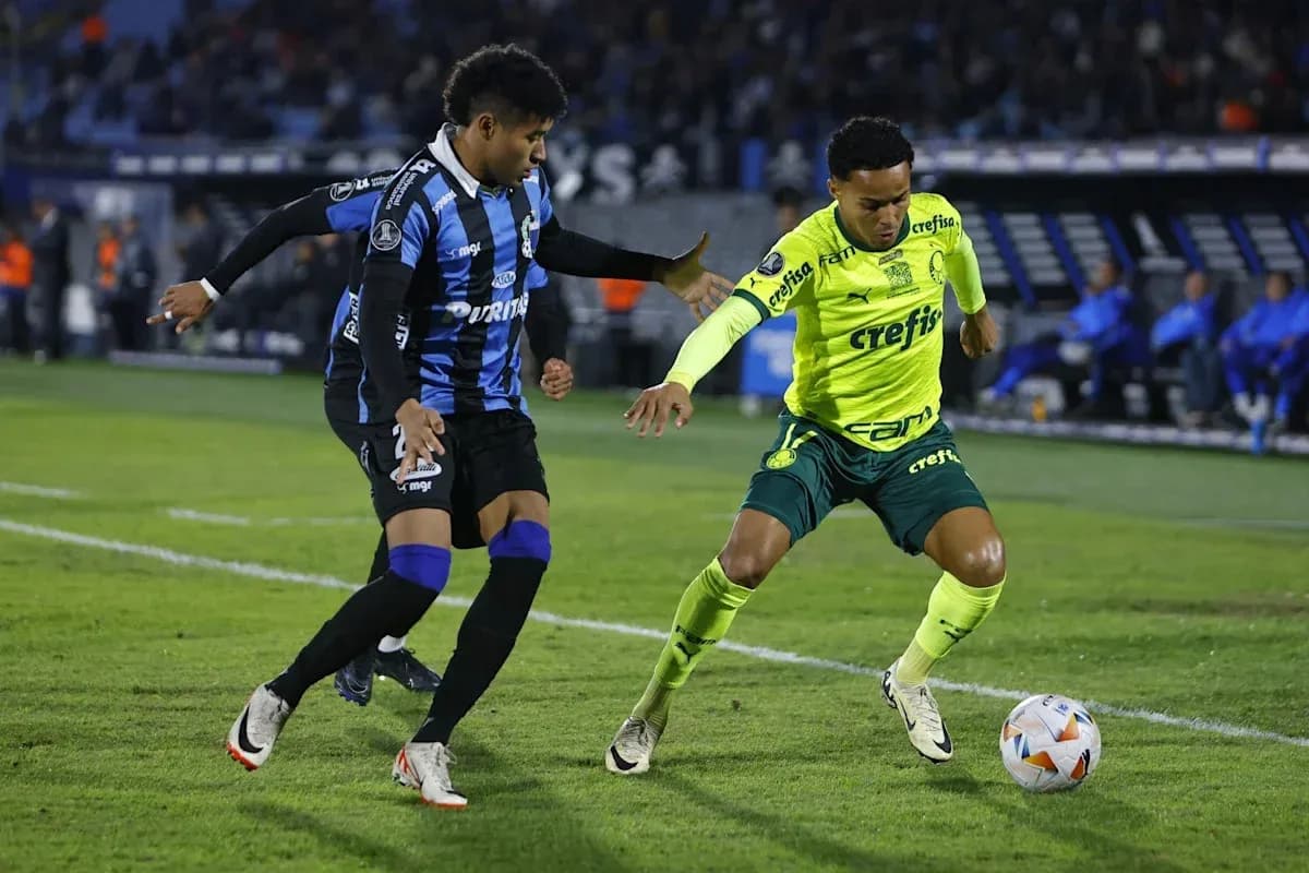 Two players contesting the ball during a match Two players contesting the ball during a match