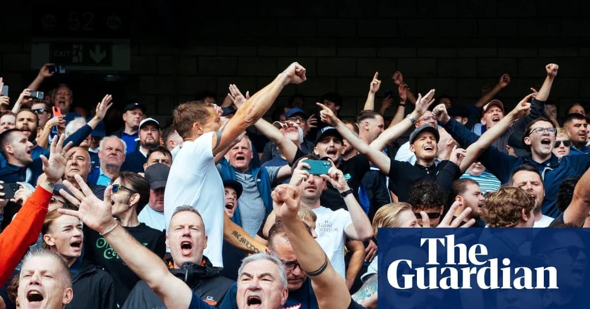 Fan crowd cheering energetically during sports event Fan crowd cheering energetically during sports event