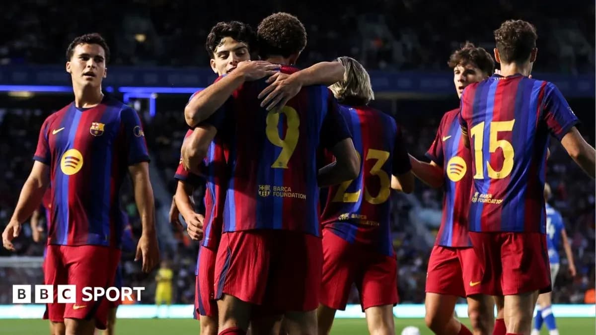 Barcelona players celebrating a goal on the field Barcelona players celebrating a goal on the field