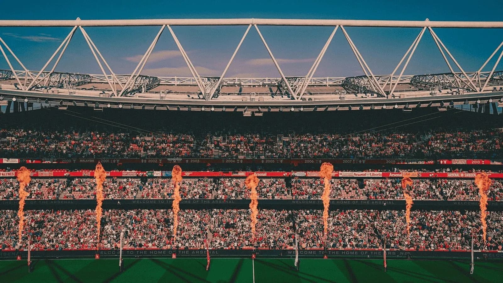 Stadium filled with fans and pyrotechnics display Stadium filled with fans and pyrotechnics display
