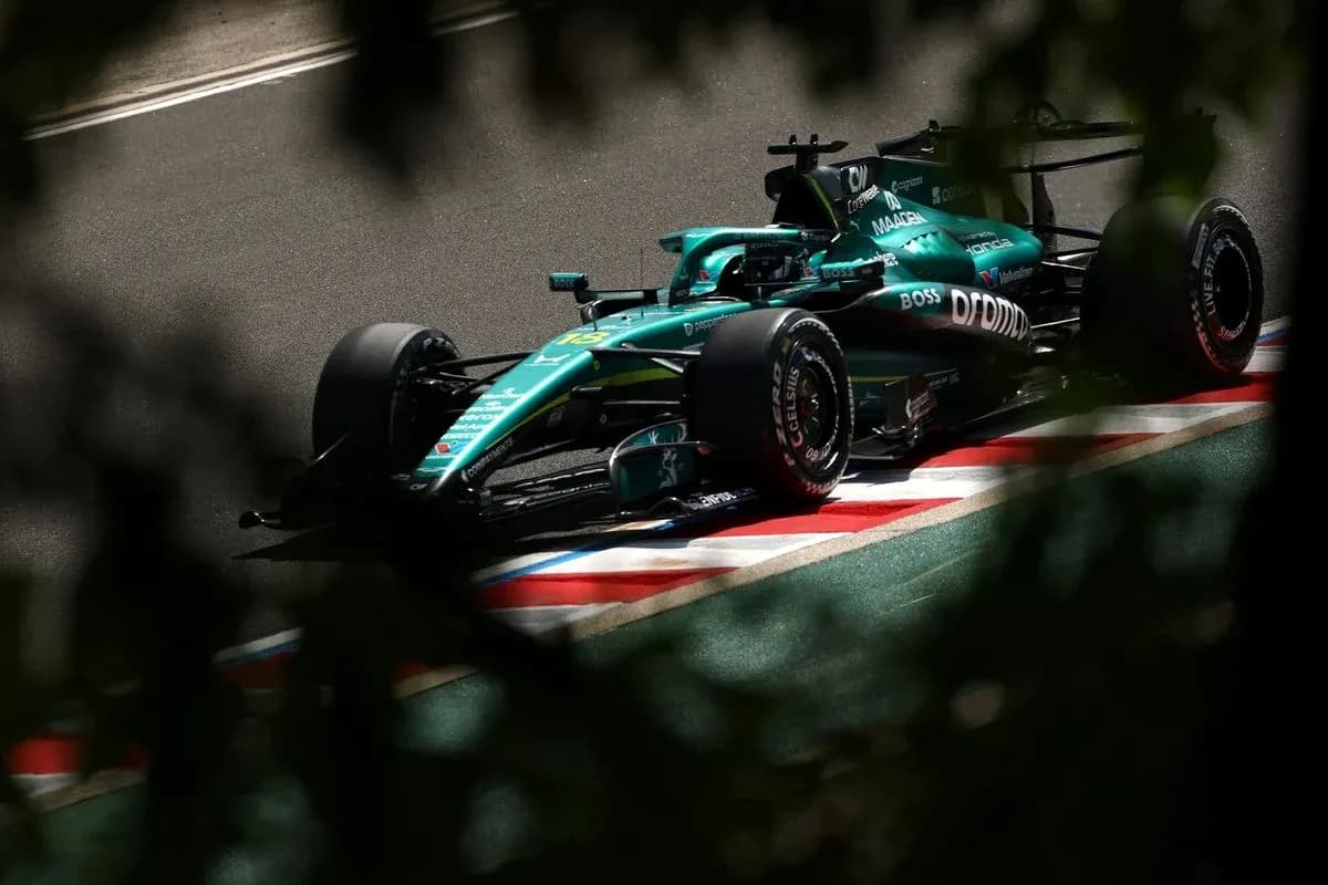 Aston Martin F1 car on track during race Aston Martin F1 car on track during race