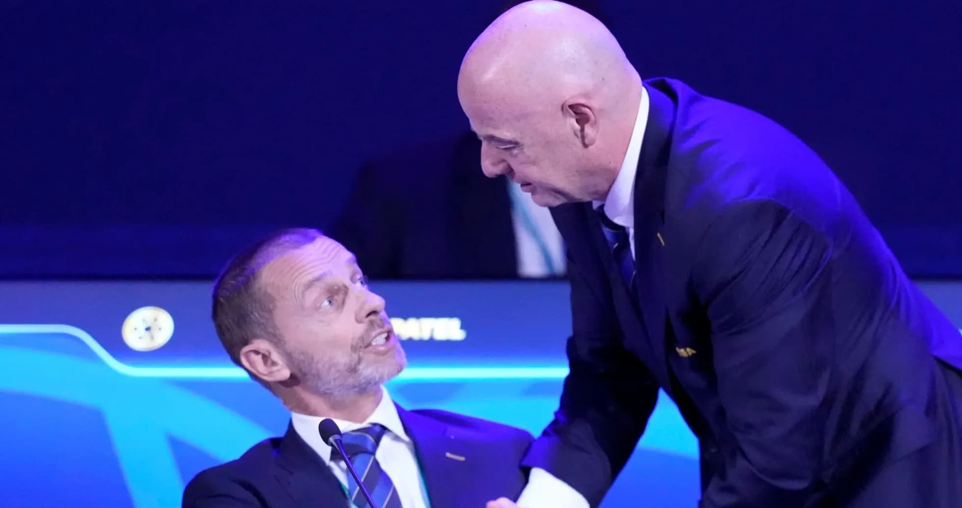 Two officials interacting at a conference table Two officials interacting at a conference table