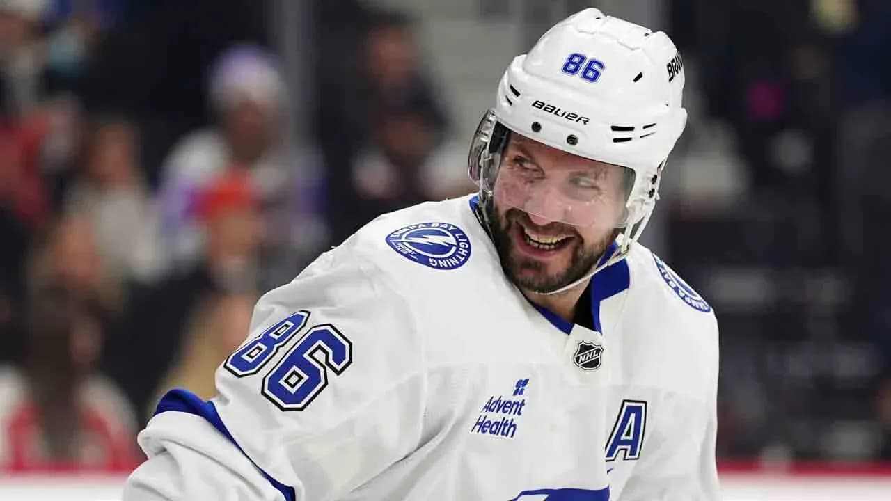 Hockey player smiling on the ice rink Hockey player smiling on the ice rink