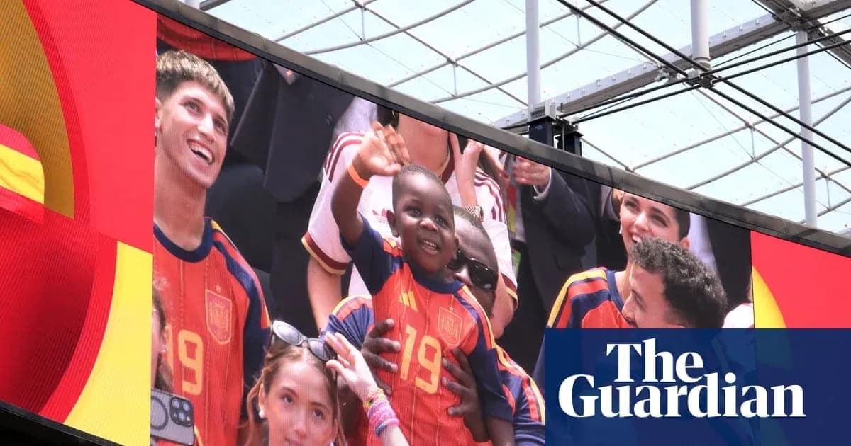 Fans celebrating with a child wearing Spain jersey Fans celebrating with a child wearing Spain jersey