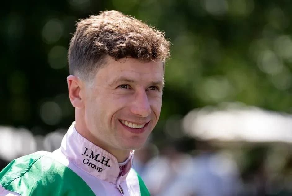 Jockey smiling in racing attire before event Jockey smiling in racing attire before event
