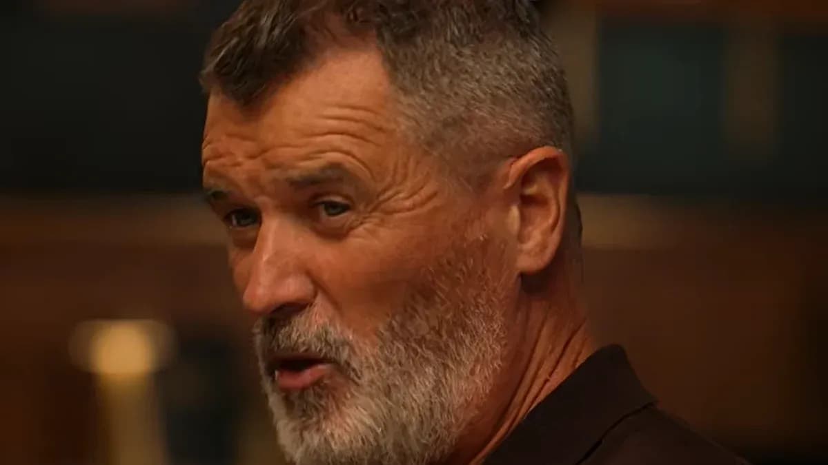 Man with gray beard speaking in a casual setting Man with gray beard speaking in a casual setting