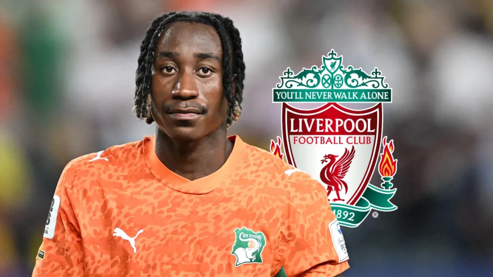 Goalkeeper in orange jersey with Liverpool logo Goalkeeper in orange jersey with Liverpool logo