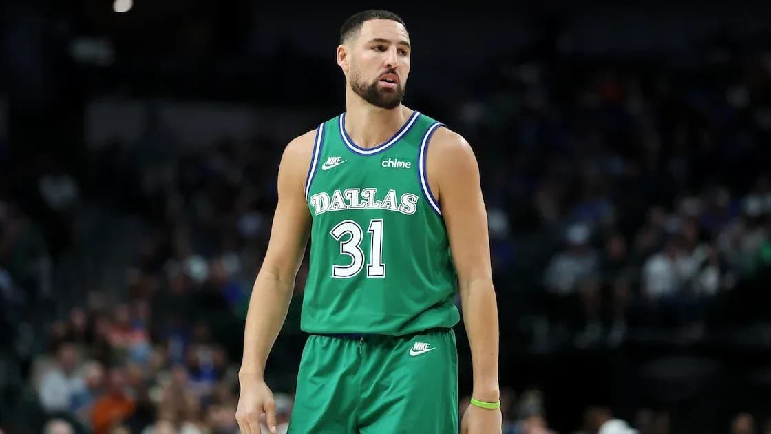 Basketball player in green Dallas jersey on court Basketball player in green Dallas jersey on court
