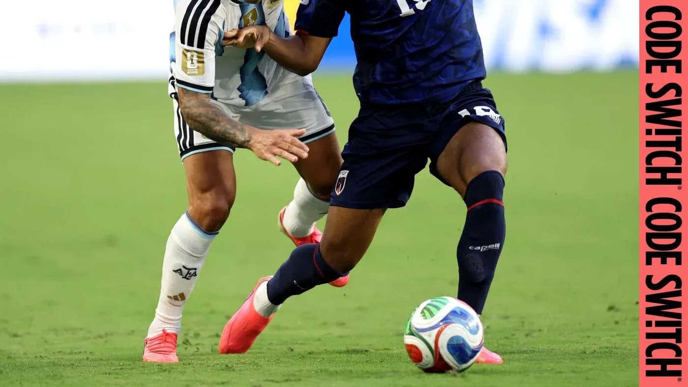 Two players competing for the ball on field Two players competing for the ball on field