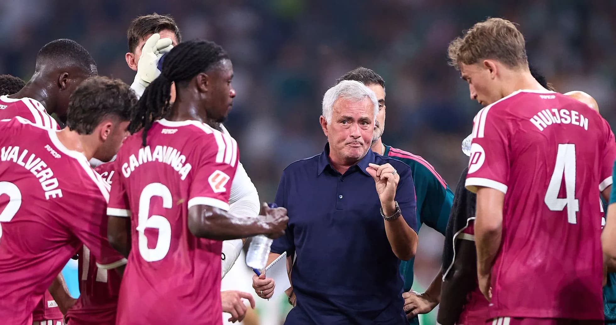 Mourinho instructing players during team huddle Mourinho instructing players during team huddle