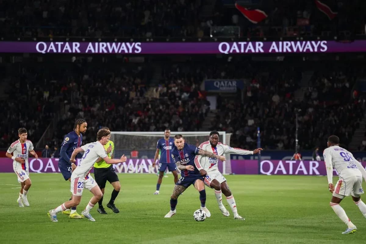 PSG players competing for the ball during match PSG players competing for the ball during match