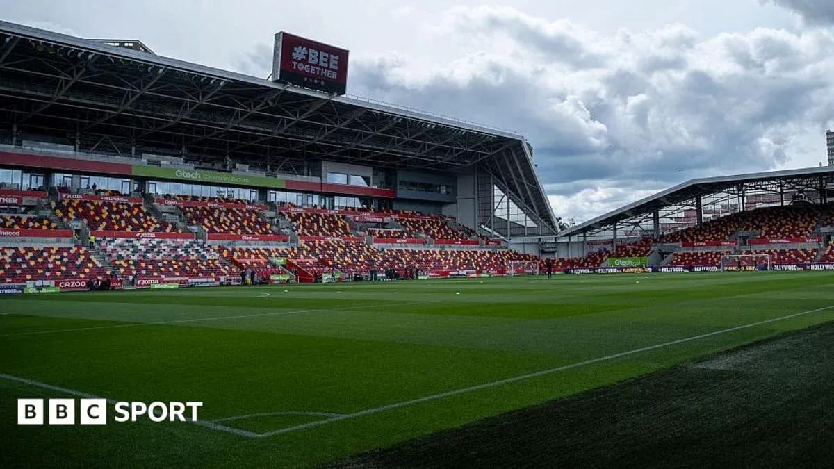 Stadium interior with empty seats and green pitch Stadium interior with empty seats and green pitch