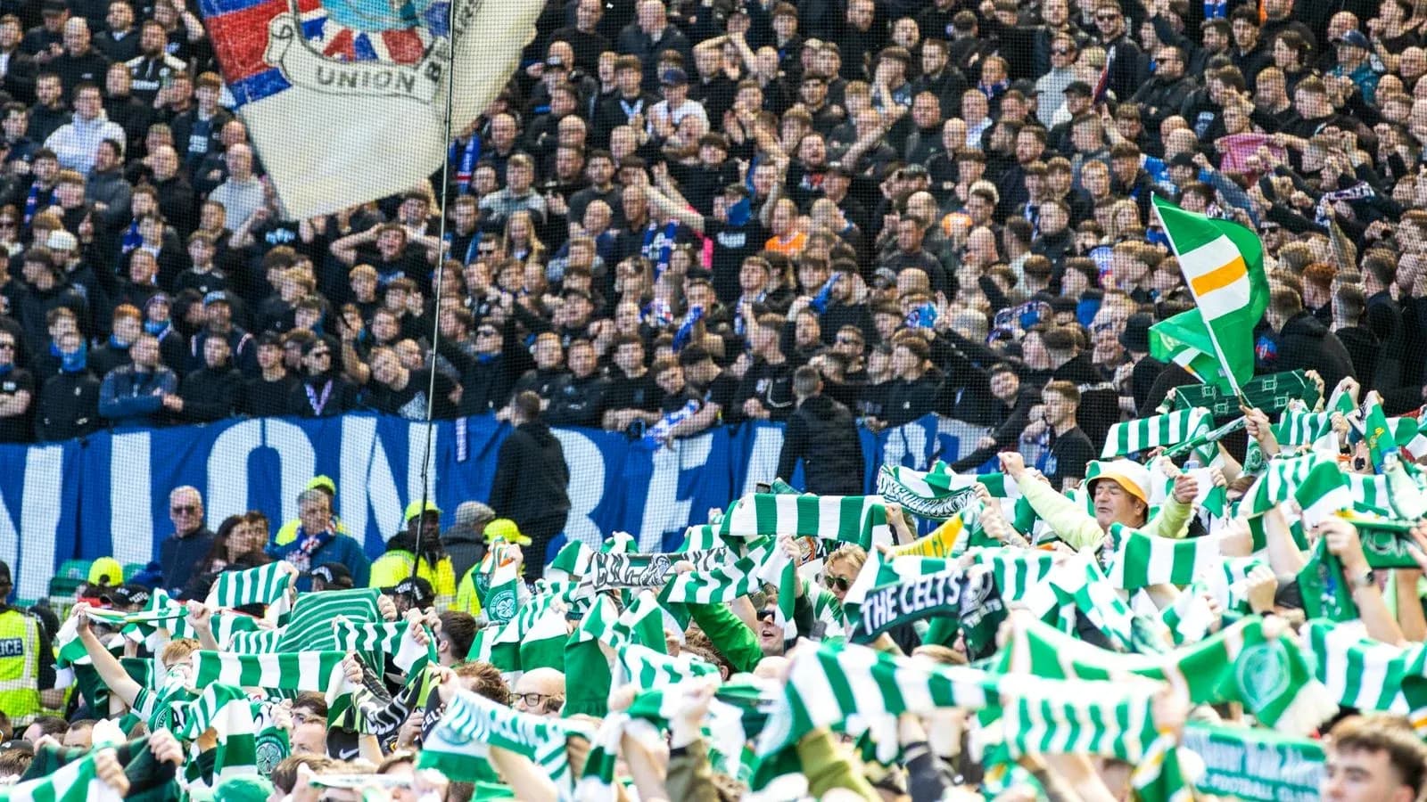 Fans waving scarves during football match celebration Fans waving scarves during football match celebration