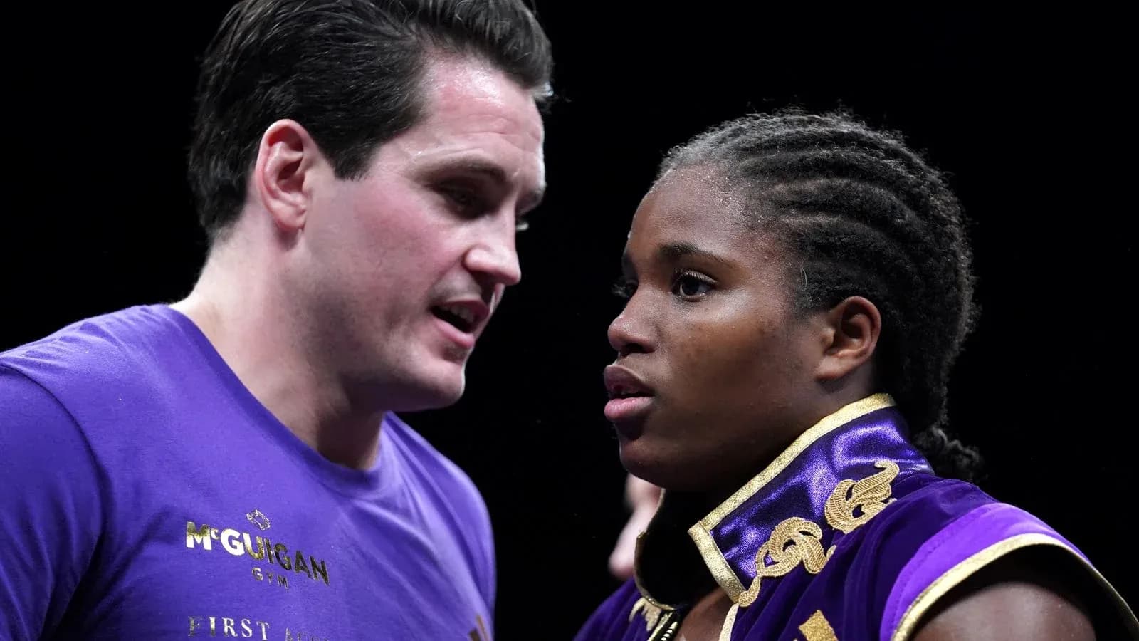 Boxer and coach discussing strategy before match Boxer and coach discussing strategy before match