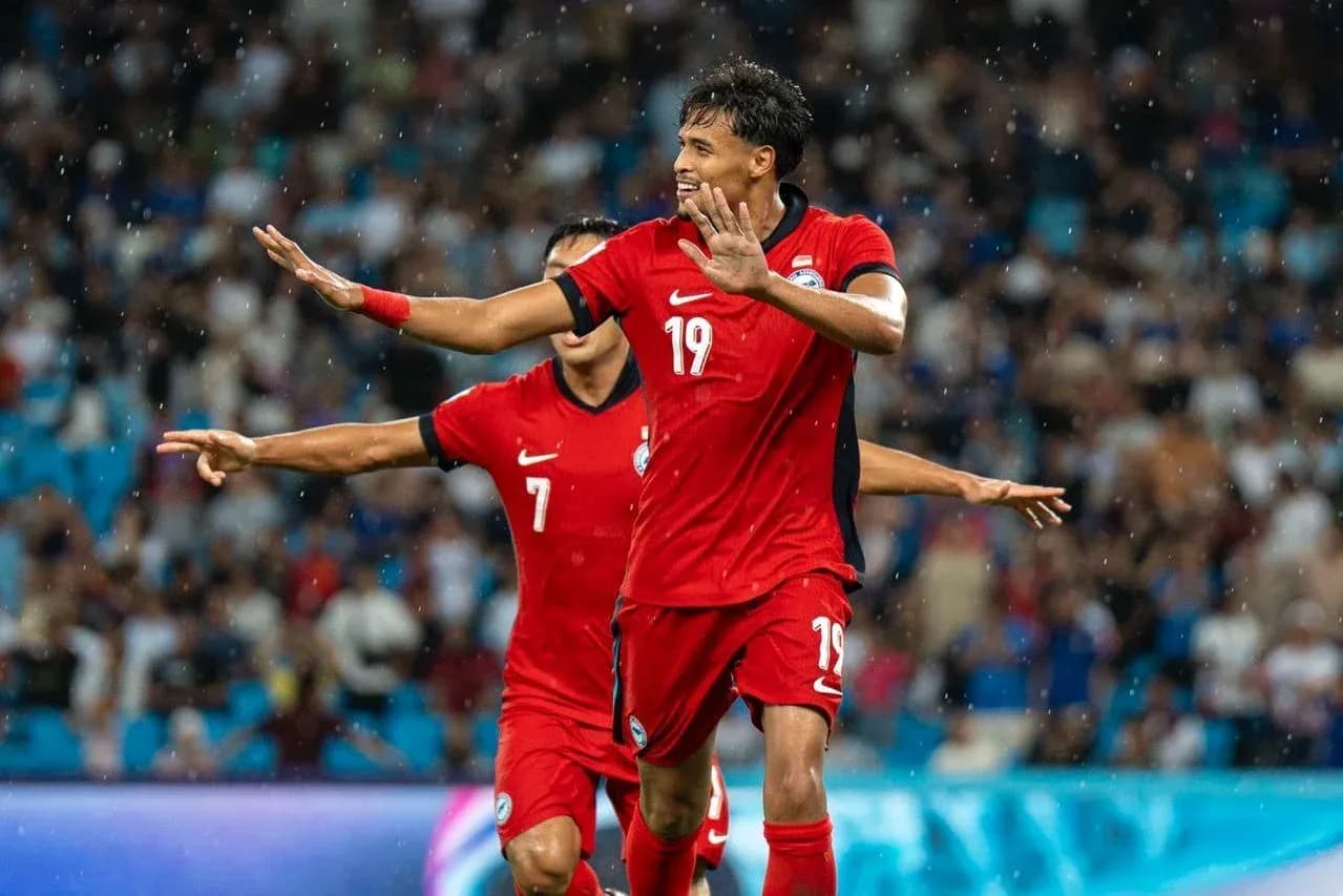 Football player celebrating goal during match Football player celebrating goal during match