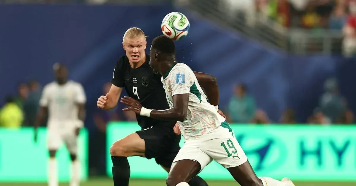 Player heading the ball during match action Player heading the ball during match action