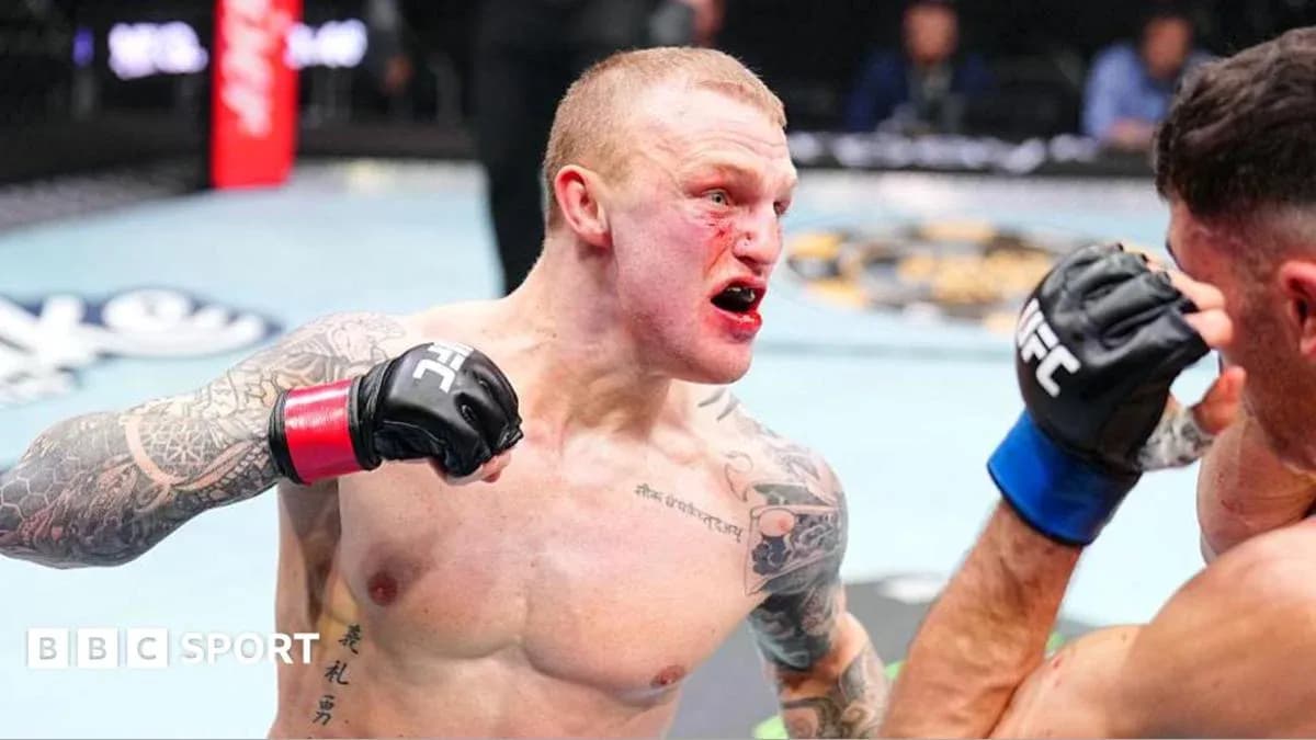 Fighter delivering a punch in the octagon Fighter delivering a punch in the octagon