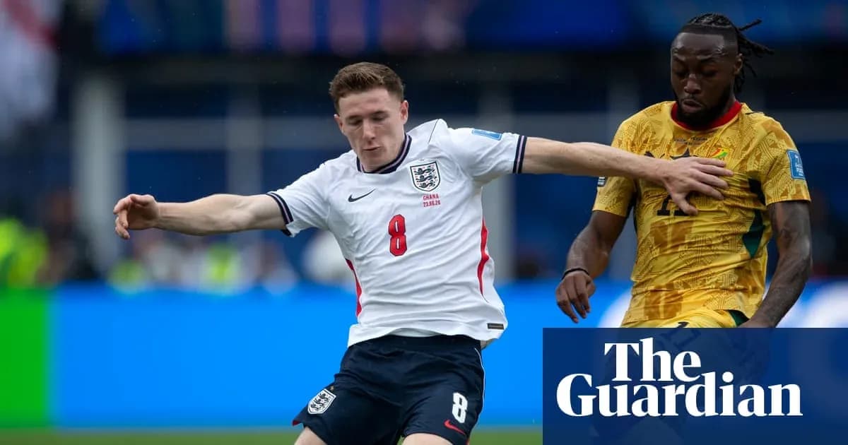 England player tackling Ghana opponent during match England player tackling Ghana opponent during match