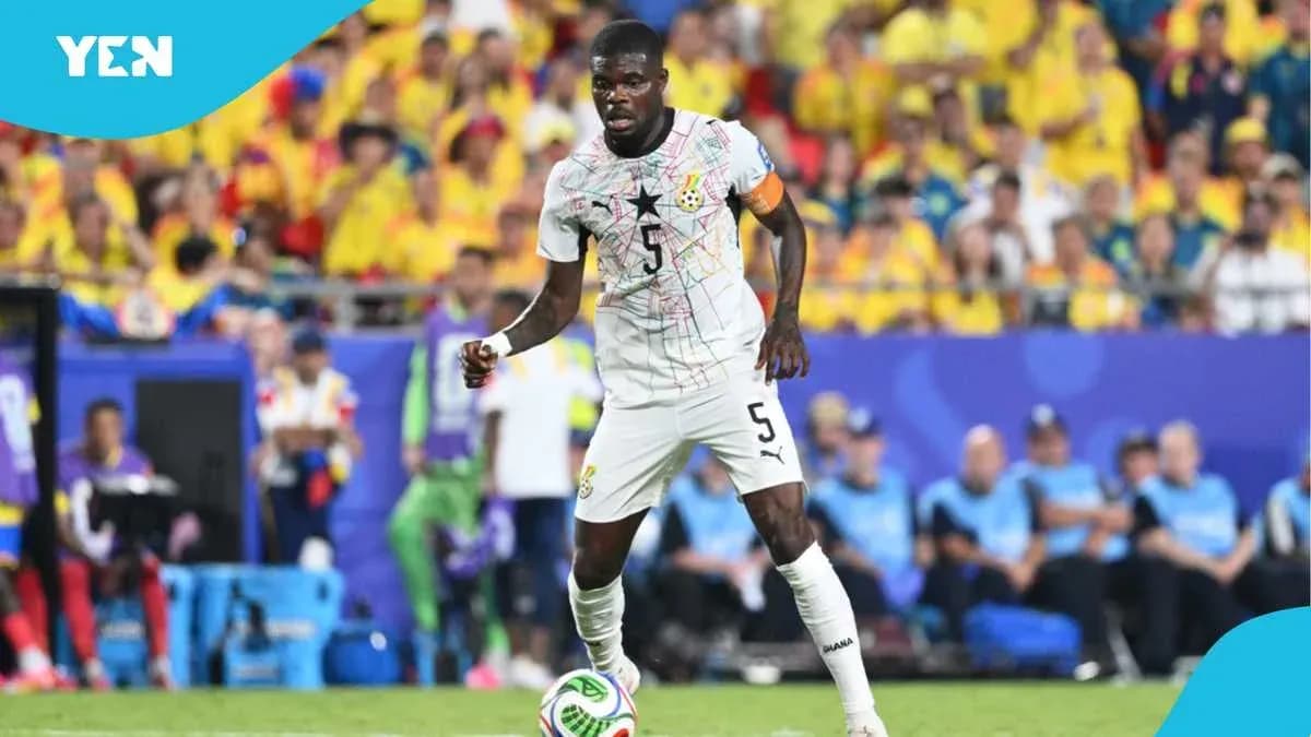 Ghana player dribbling the ball during a match Ghana player dribbling the ball during a match