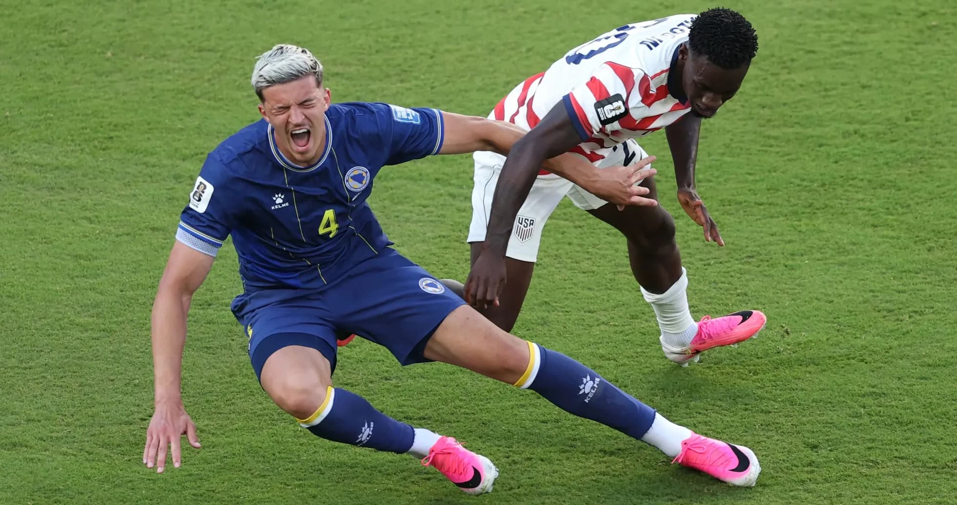 Bosnia player falls while contesting for the ball Bosnia player falls while contesting for the ball